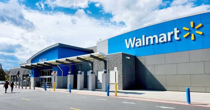 shutterstock_2448489595.jpg featured image Walmart store entrance with blue skies above
