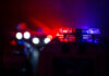 Police car lights shining in the dark