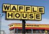 Waffle House sign in front of restaurant building.