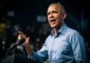 Barack Obama speaks at podium.