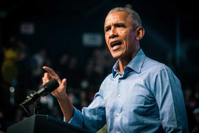 Barack Obama speaks at podium.