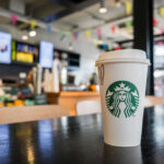 Coffee cup on table in cafe interior