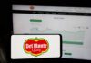 Del Monte logo on smartphone stock chart background