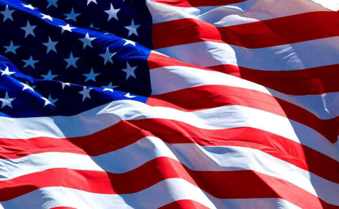 shutterstock_267522383-1.jpg USA flag waving in the wind