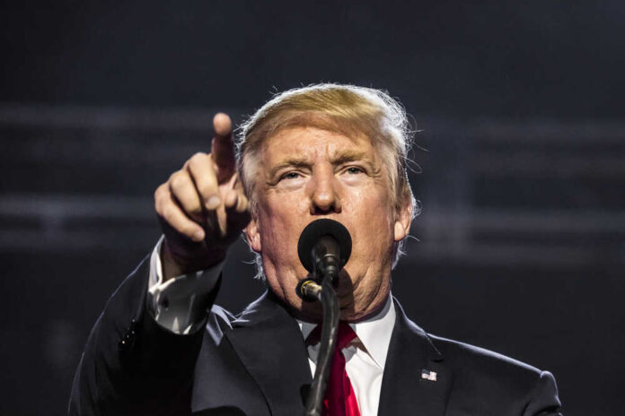 Donald Trump, points while speaking.