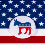 Democratic Party donkey logo on American flag background