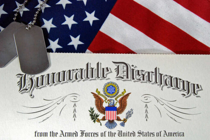 shutterstock_105384593.jpg Military dog tags on honorable discharge certificate