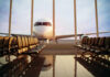 Airplane viewed from an empty airport waiting area
