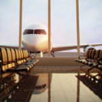 Airplane viewed from an empty airport waiting area