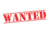 Red WANTED stamp on white background