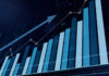 Rising bar graph with upward trending line chart