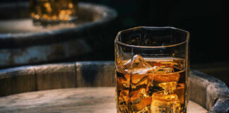 Glass of whiskey with ice