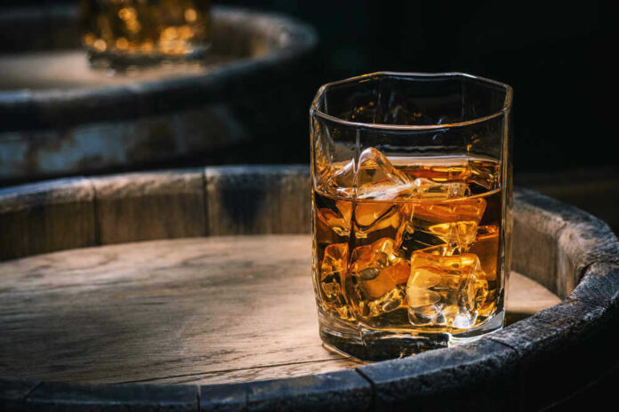 Glass of whiskey with ice