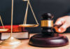 Judge gavel, scales of justice and law books