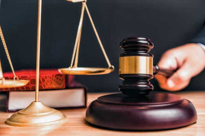 Judge gavel, scales of justice and law books
