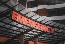 Illuminated emergency sign at a hospital entrance