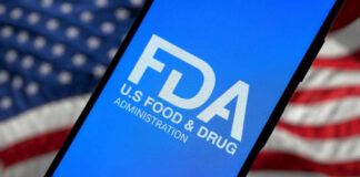 FDA logo on smartphone American flag background