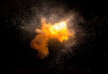 Bright explosion against a dark background with sparks