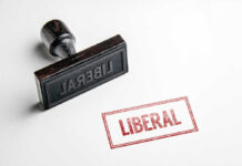 Rubber stamp with the word LIBERAL