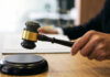 Gavel in judges hand about to strike