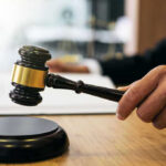 Gavel in judges hand about to strike