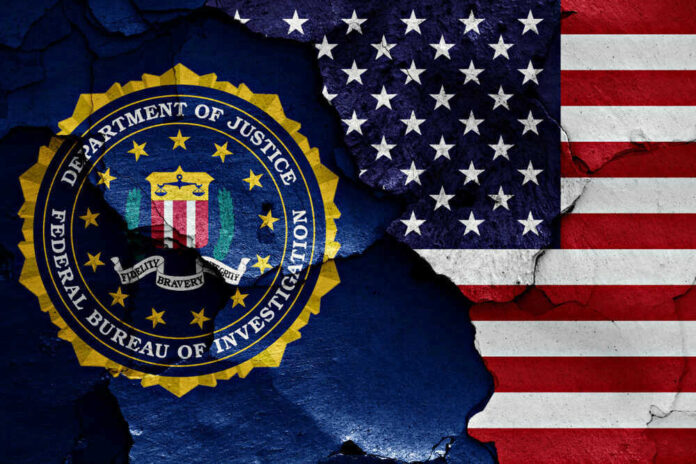 FBI seal superimposed on cracked American flag