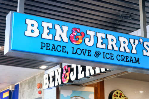 Signage for Ben and Jerry's ice cream shop displaying the slogan Peace, Love and Ice Cream