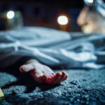 Manhunt Ends: Remains of Suspected Child Killer Found Crime scene with covered body and hand exposed