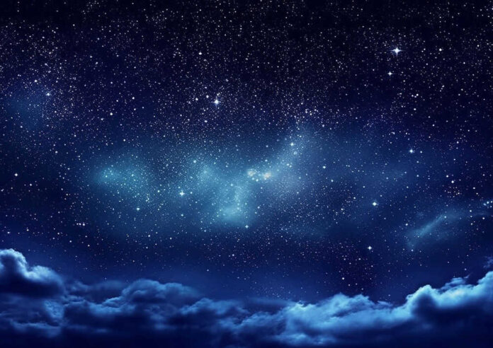 Starry night sky with clouds below