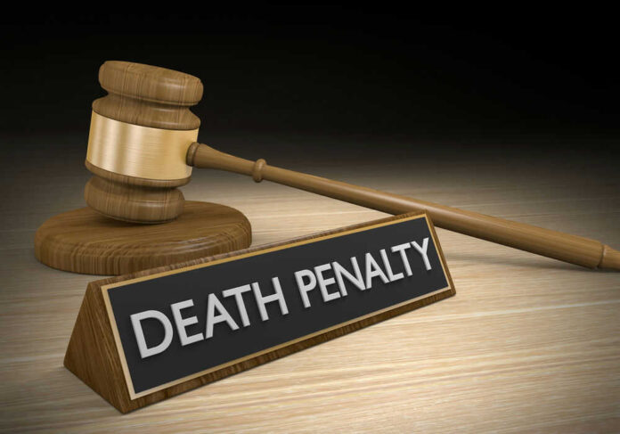 Gavel beside death penalty sign on desk
