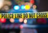 Police tape and lights at crime scene
