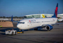 TODAY: U.S. Airport System Collapsing Delta airplane being towed at airport terminal gate
