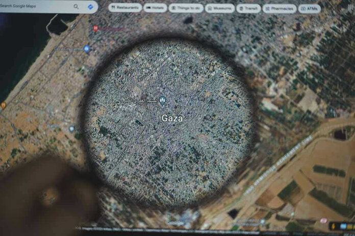 Magnifying glass highlighting Gaza on Google Maps