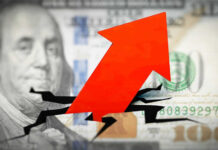 Red arrow on cracked $100 bill.