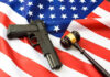 Gun and gavel on a US flag