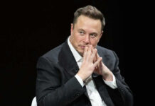 Elon Musk in suit thinking