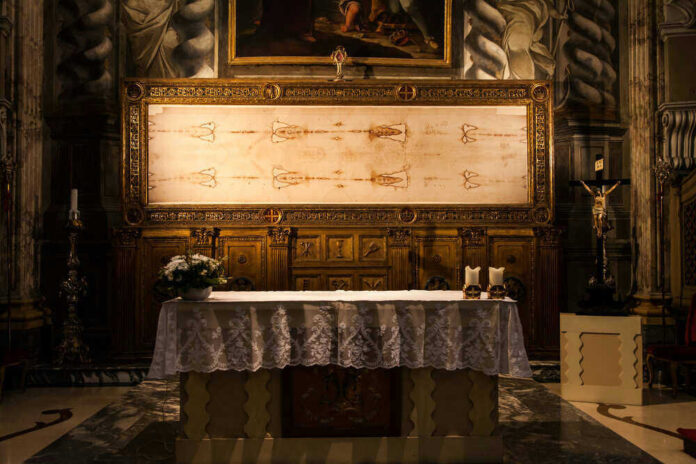Church altar with Shroud of Turin above it