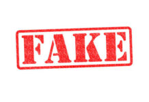 Trump FIRES BACK at Fake News Rumors Red stamp with the word FAKE prominently displayed