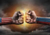 U.S. and Russian flag fists colliding dramatically.