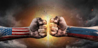 U.S. and Russian flag fists colliding dramatically.