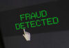 Fraud detected text with a pixelated cursor icon.