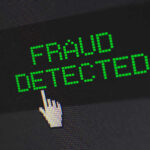 Fraud detected text with a pixelated cursor icon.