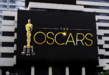 Oscars billboard on a city building exterior wall