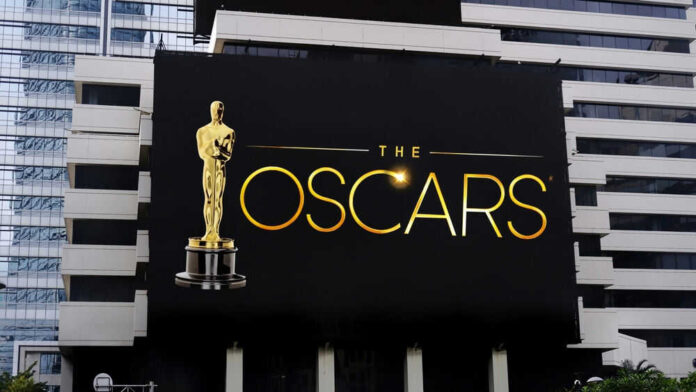 Oscars billboard on a city building exterior wall