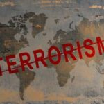 World map with the word TERRORISM crossed out in red