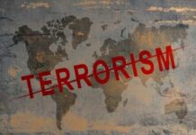 TARGETED Strike Eliminates Terrorist Who Had $5 Million Bounty World map with the word TERRORISM crossed out in red