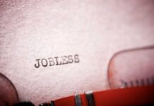 MASSIVE Job Market Collapse Stuns America Close-up of a typewriter with the word 'JOBLESS' typed on paper