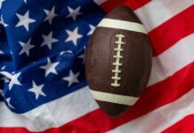 Netflix Football Coach GUNNED DOWN On Campus An American football resting on a background of the American flag