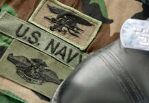 Operation Southern Spear: U.S. Navy’s Power Displayed Military patches and dog tag on camouflage fabric