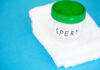 Cancer Time Bomb Lurks in Donor Sperm Container labeled 'SPERM' on a white towel against a blue background